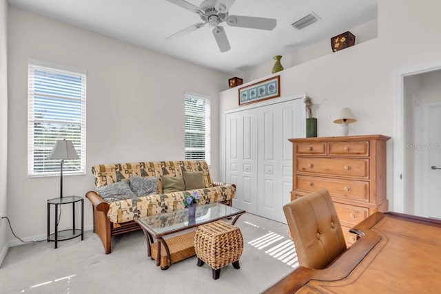 3620 Como St, Port Charlotte, FL 33948 - living area featuring a ceiling fan and light carpet
