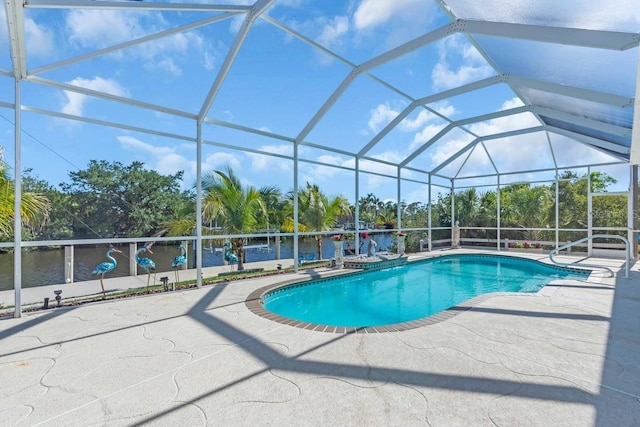 3620 Como St, Port Charlotte, FL 33948 - swimming pool featuring a patio, glass enclosure, and a water view