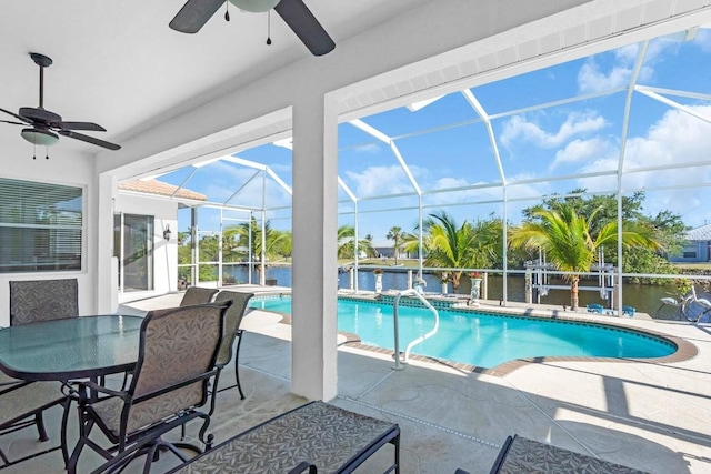 3620 Como St, Port Charlotte, FL 33948 - swimming pool featuring ceiling fan, a patio, a water view, and glass enclosure