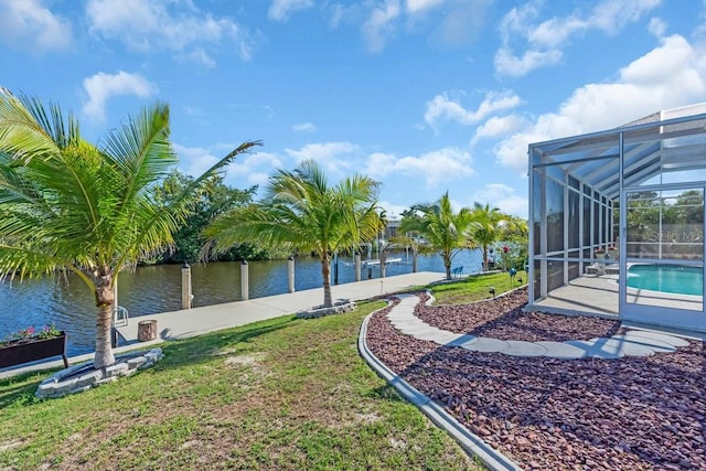 3620 Como St, Port Charlotte, FL 33948 - view of grassy yard with an outdoor pool, a water view, and glass enclosure