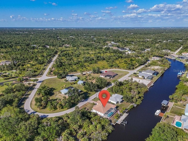3620 Como St, Port Charlotte, FL 33948 - view of property location featuring a heavily wooded area, a nearby body of water, and nearby suburban area