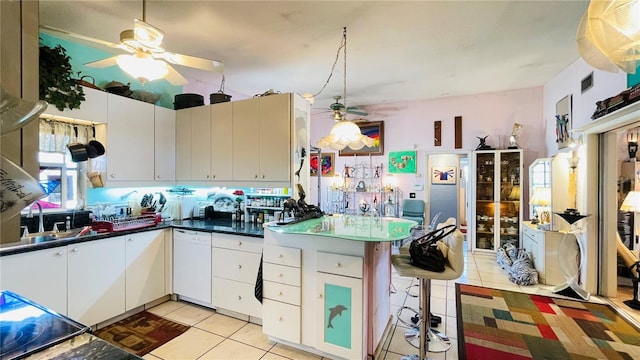 409 Bryn Mawr Is, Bradenton, FL 34207 - kitchen featuring ceiling fan, light tile patterned flooring, dishwasher, and a peninsula
