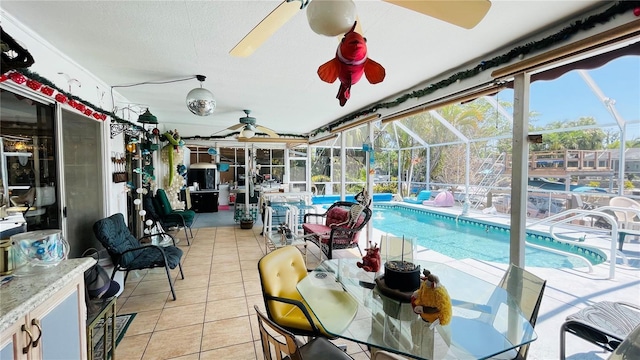 409 Bryn Mawr Is, Bradenton, FL 34207 - sunroom featuring a ceiling fan and a swimming pool