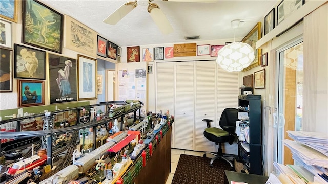 409 Bryn Mawr Is, Bradenton, FL 34207 - home office with ceiling fan and light tile patterned floors