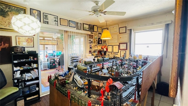 409 Bryn Mawr Is, Bradenton, FL 34207 - game room with ceiling fan and plenty of natural light