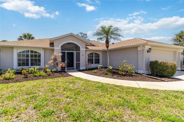 251 Broadmoor Ln, Rotonda West, FL 33947 - ranch-style home with stucco siding, a garage, and a front yard