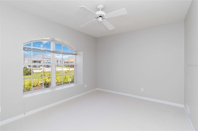 251 Broadmoor Ln, Rotonda West, FL 33947 - empty room with light colored carpet, baseboards, and ceiling fan