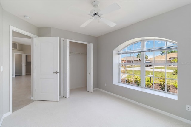 251 Broadmoor Ln, Rotonda West, FL 33947 - unfurnished bedroom featuring light carpet, baseboards, and a closet
