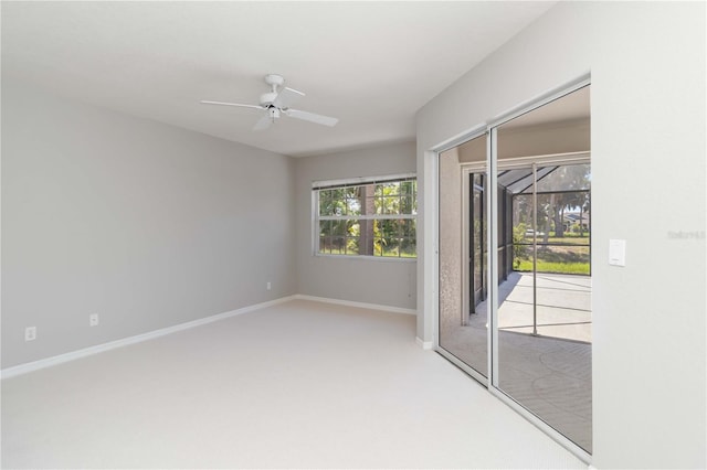 251 Broadmoor Ln, Rotonda West, FL 33947 - empty room with carpet floors, a ceiling fan, and baseboards