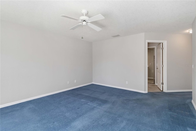 251 Broadmoor Ln, Rotonda West, FL 33947 - empty room with baseboards, a ceiling fan, and dark colored carpet