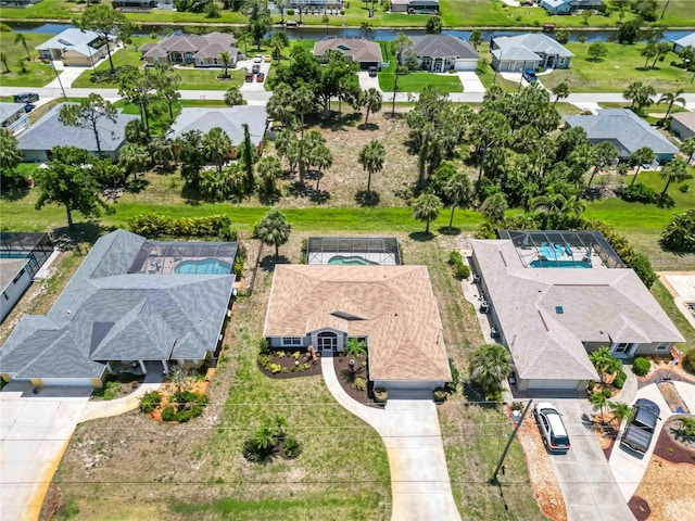 251 Broadmoor Ln, Rotonda West, FL 33947 - aerial perspective of suburban area featuring a large body of water