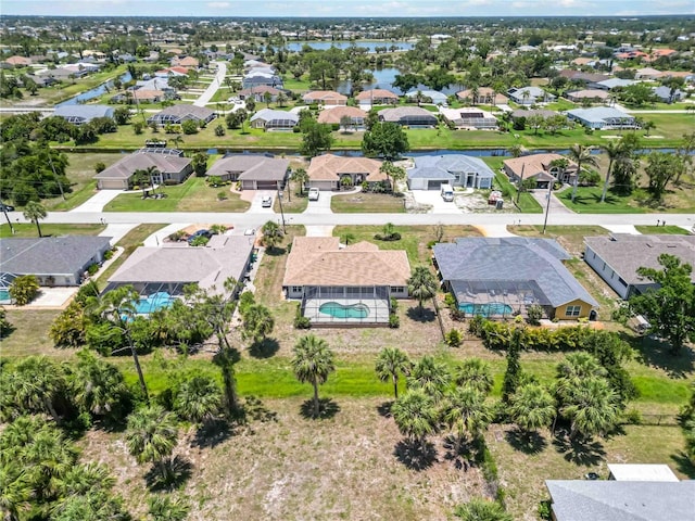 251 Broadmoor Ln, Rotonda West, FL 33947 - aerial perspective of suburban area with a large body of water and a pool