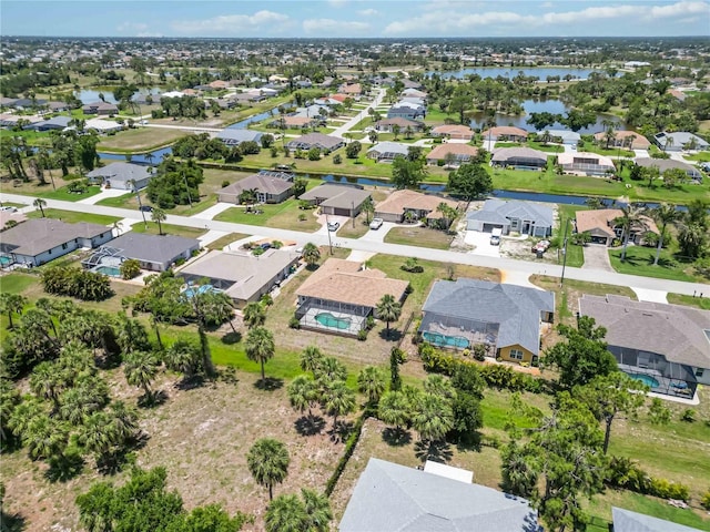 251 Broadmoor Ln, Rotonda West, FL 33947 - aerial overview of property's location with a nearby body of water and nearby suburban area