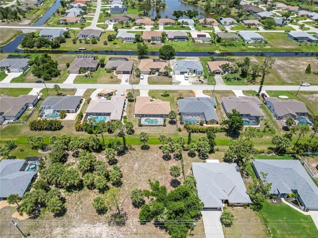251 Broadmoor Ln, Rotonda West, FL 33947 - aerial view of property and surrounding area with nearby suburban area and a large body of water