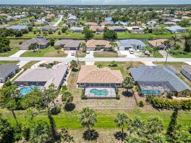 251 Broadmoor Ln, Rotonda West, FL 33947 - aerial perspective of suburban area with a pool area