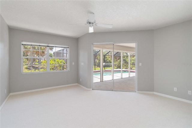 251 Broadmoor Ln, Rotonda West, FL 33947 - empty room with a ceiling fan, carpet, and baseboards