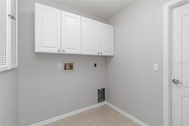 251 Broadmoor Ln, Rotonda West, FL 33947 - laundry room with hookup for a washing machine, cabinet space, electric dryer hookup, baseboards, and light tile patterned floors