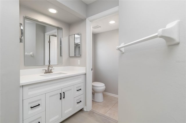 251 Broadmoor Ln, Rotonda West, FL 33947 - bathroom with vanity, toilet, tile patterned floors, and recessed lighting