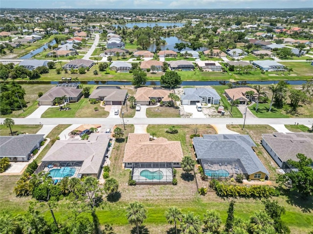 251 Broadmoor Ln, Rotonda West, FL 33947 - aerial view of property's location with nearby suburban area, a nearby body of water, and a pool