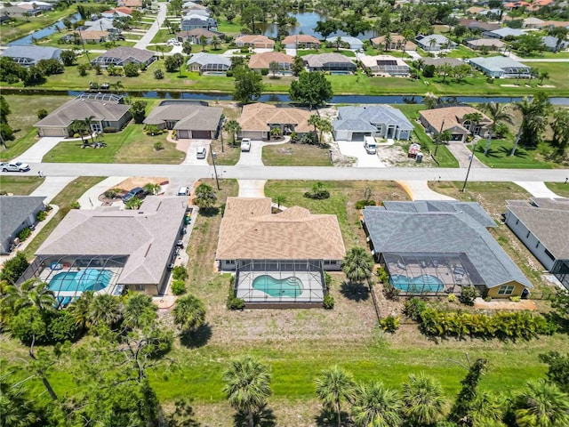 251 Broadmoor Ln, Rotonda West, FL 33947 - aerial view of residential area with a pool and a nearby body of water
