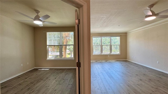 4142 Central Sarasota Pkwy Unit 1423, Sarasota, FL 34238 - unfurnished room with ceiling fan, a textured ceiling, wood finished floors, baseboards, and ornamental molding