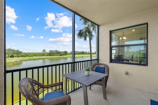 7005 River Hammock Dr Unit 203, Bradenton, FL 34212 - sunroom featuring a water view