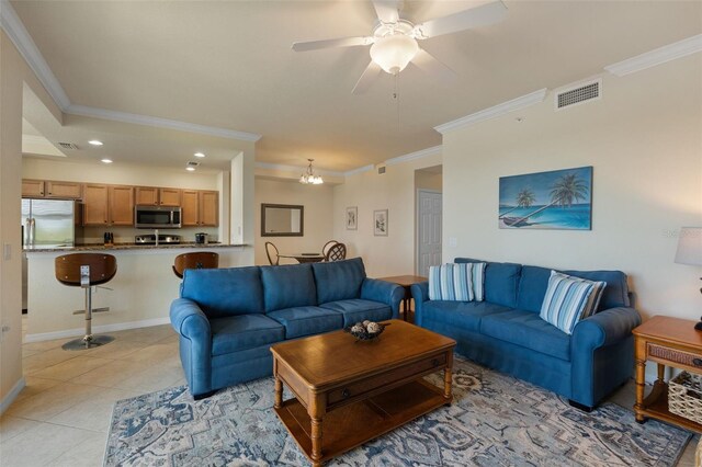 7005 River Hammock Dr Unit 203, Bradenton, FL 34212 - living room with ornamental molding, recessed lighting, a ceiling fan, light tile patterned floors, and a chandelier