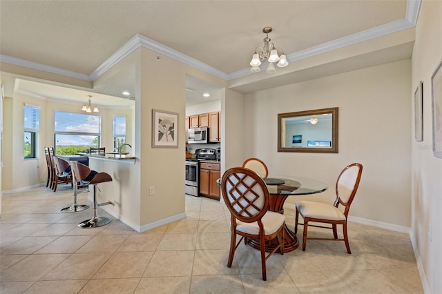 7005 River Hammock Dr Unit 203, Bradenton, FL 34212 - dining area featuring a chandelier, ornamental molding, baseboards, and light tile patterned flooring