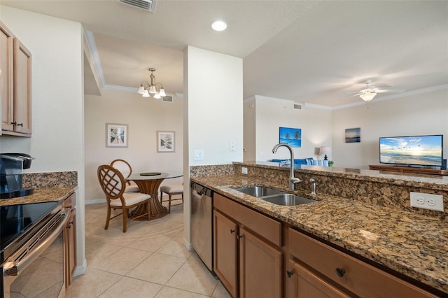 7005 River Hammock Dr Unit 203, Bradenton, FL 34212 - kitchen featuring a sink, stainless steel appliances, dark stone counters, crown molding, and light tile patterned floors