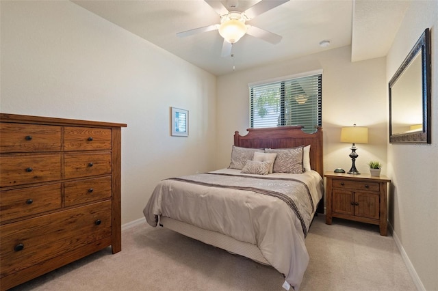 7005 River Hammock Dr Unit 203, Bradenton, FL 34212 - bedroom with light carpet, baseboards, and a ceiling fan
