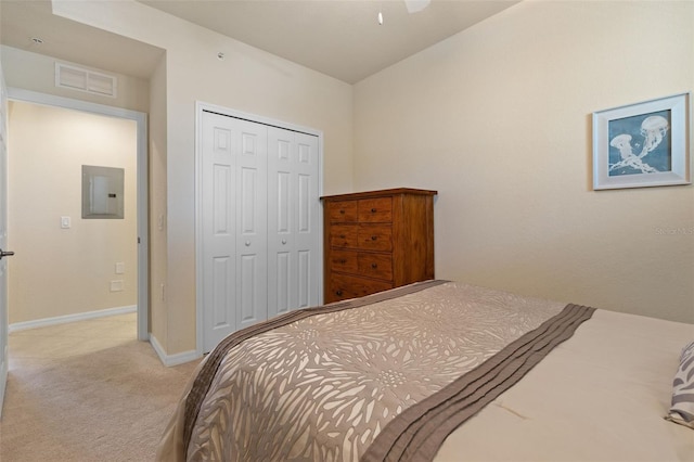7005 River Hammock Dr Unit 203, Bradenton, FL 34212 - carpeted bedroom featuring electric panel, a closet, baseboards, and vaulted ceiling