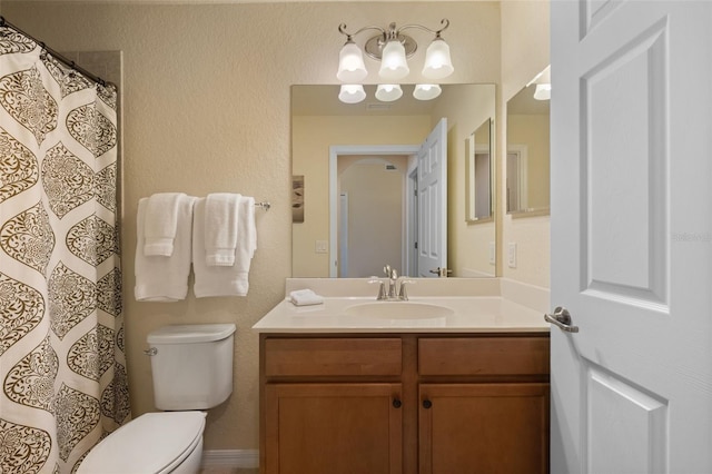 7005 River Hammock Dr Unit 203, Bradenton, FL 34212 - bathroom with toilet, vanity, a textured wall, and curtained shower