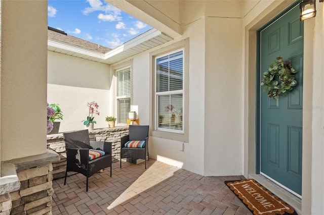 5816 Mezzana Run, Palmetto, FL 34221 - entrance to property featuring stucco siding and a patio area