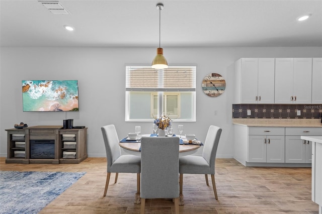 5816 Mezzana Run, Palmetto, FL 34221 - dining space with light wood-type flooring, recessed lighting, and baseboards