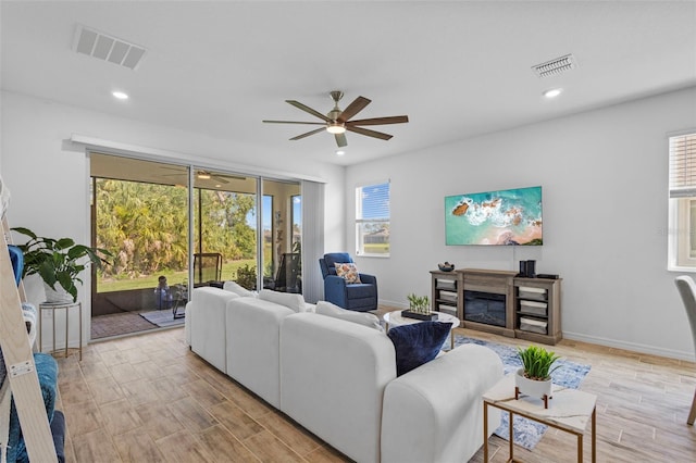 5816 Mezzana Run, Palmetto, FL 34221 - living area with ceiling fan, plenty of natural light, light wood-style floors, and recessed lighting