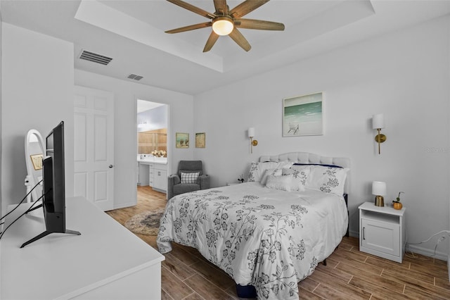 5816 Mezzana Run, Palmetto, FL 34221 - bedroom featuring a raised ceiling, wood finished floors, baseboards, and ceiling fan