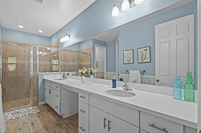 5816 Mezzana Run, Palmetto, FL 34221 - full bath with a shower stall, double vanity, and wood tiled floors