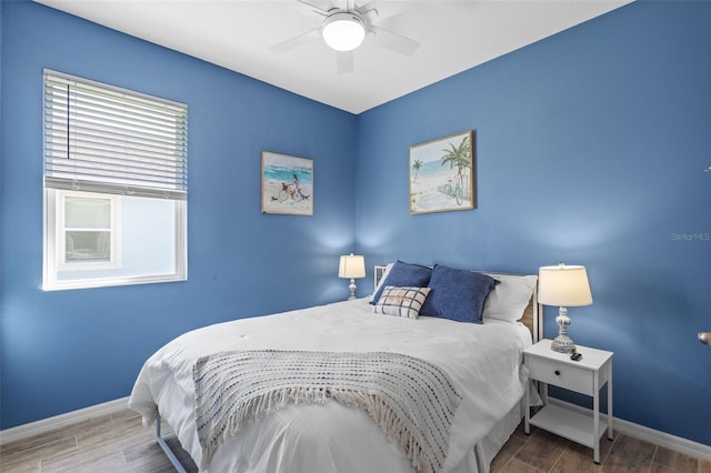 5816 Mezzana Run, Palmetto, FL 34221 - bedroom with wood tiled floors, baseboards, and a ceiling fan