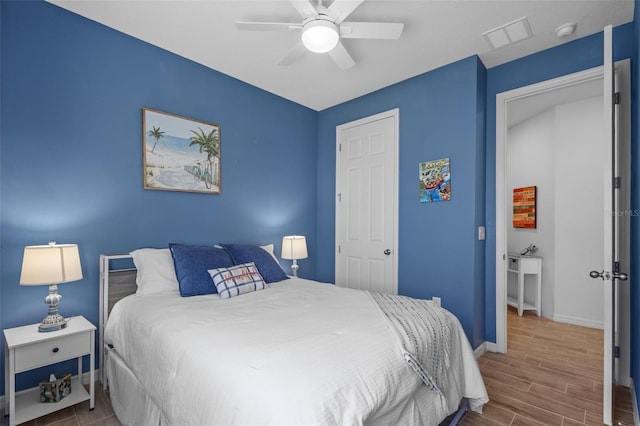5816 Mezzana Run, Palmetto, FL 34221 - bedroom featuring baseboards, wood finished floors, and ceiling fan