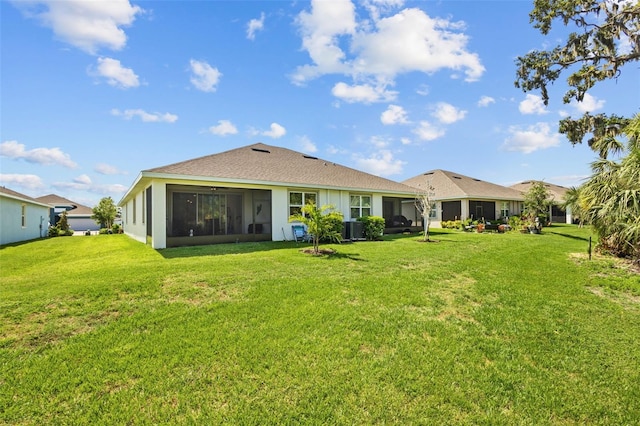 5816 Mezzana Run, Palmetto, FL 34221 - back of property with a sunroom, a yard, and cooling unit