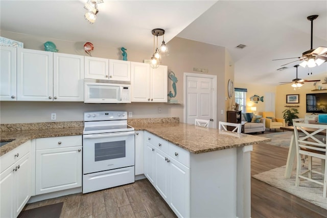 2801 Dalhart Ave, North Port, FL 34286 - kitchen featuring white appliances, a peninsula, ceiling fan, and white cabinetry