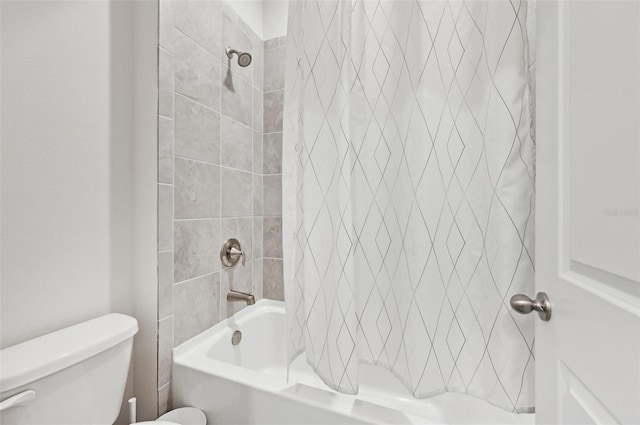 bathroom featuring toilet and shower / bath combo