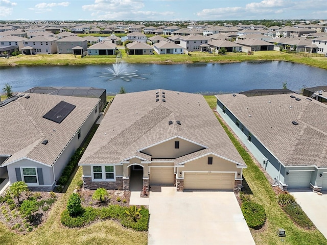 aerial view of residential area with a large body of water