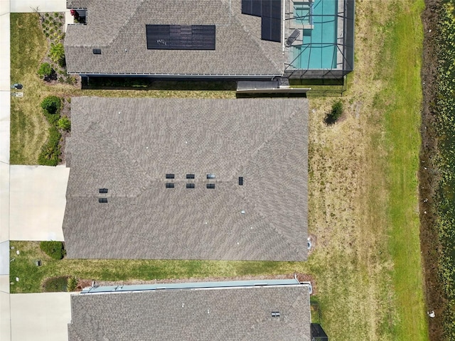 view of subject property with a pool