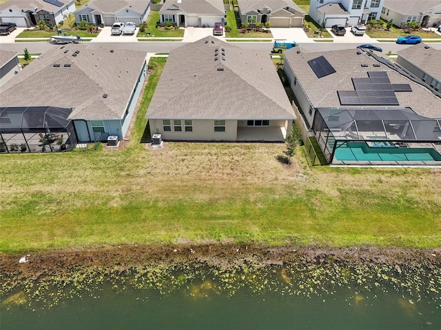 aerial perspective of suburban area featuring a large body of water