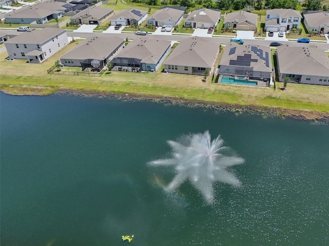 aerial perspective of suburban area featuring a nearby body of water