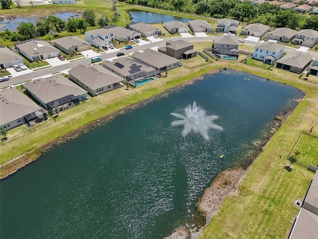 aerial perspective of suburban area with a nearby body of water