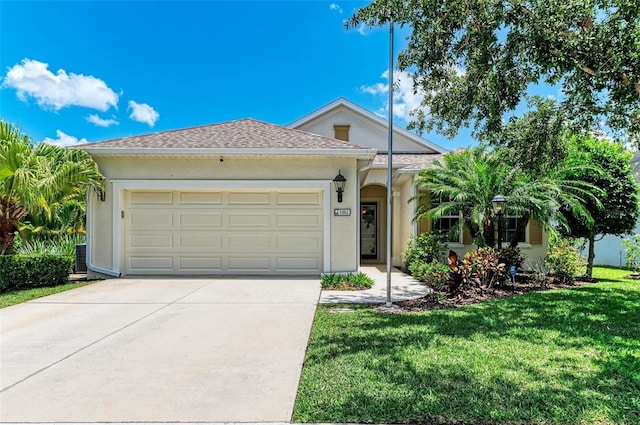 11811 Fennemore Way, Parrish, FL 34219 - ranch-style house featuring driveway, a garage, a front lawn, and stucco siding