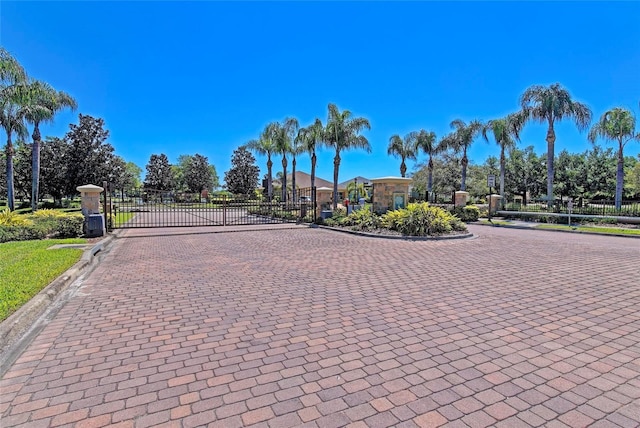 11811 Fennemore Way, Parrish, FL 34219 - view of decorative street featuring curbs, a gate, and a gated entry