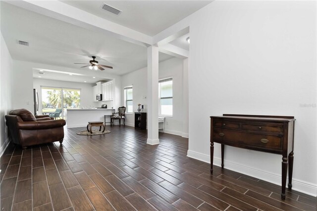 10926 Sand Pine Ln, Parrish, FL 34219 - living area featuring ceiling fan, baseboards, and dark wood-type flooring